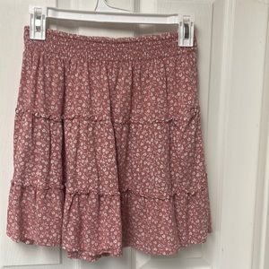 Super cute juniors skirt, looks new. Cute flower pattern, elastic waist